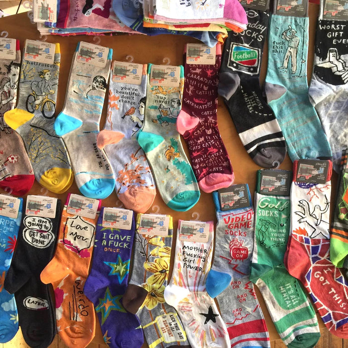 Collection of dozens of Blue Q socks