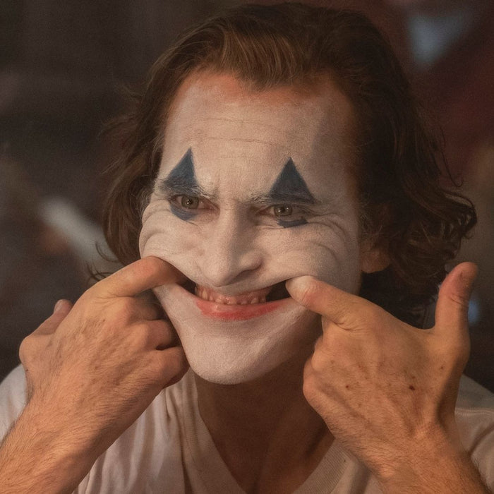 Stressed Joaquin Phoenix Joker trying to smile